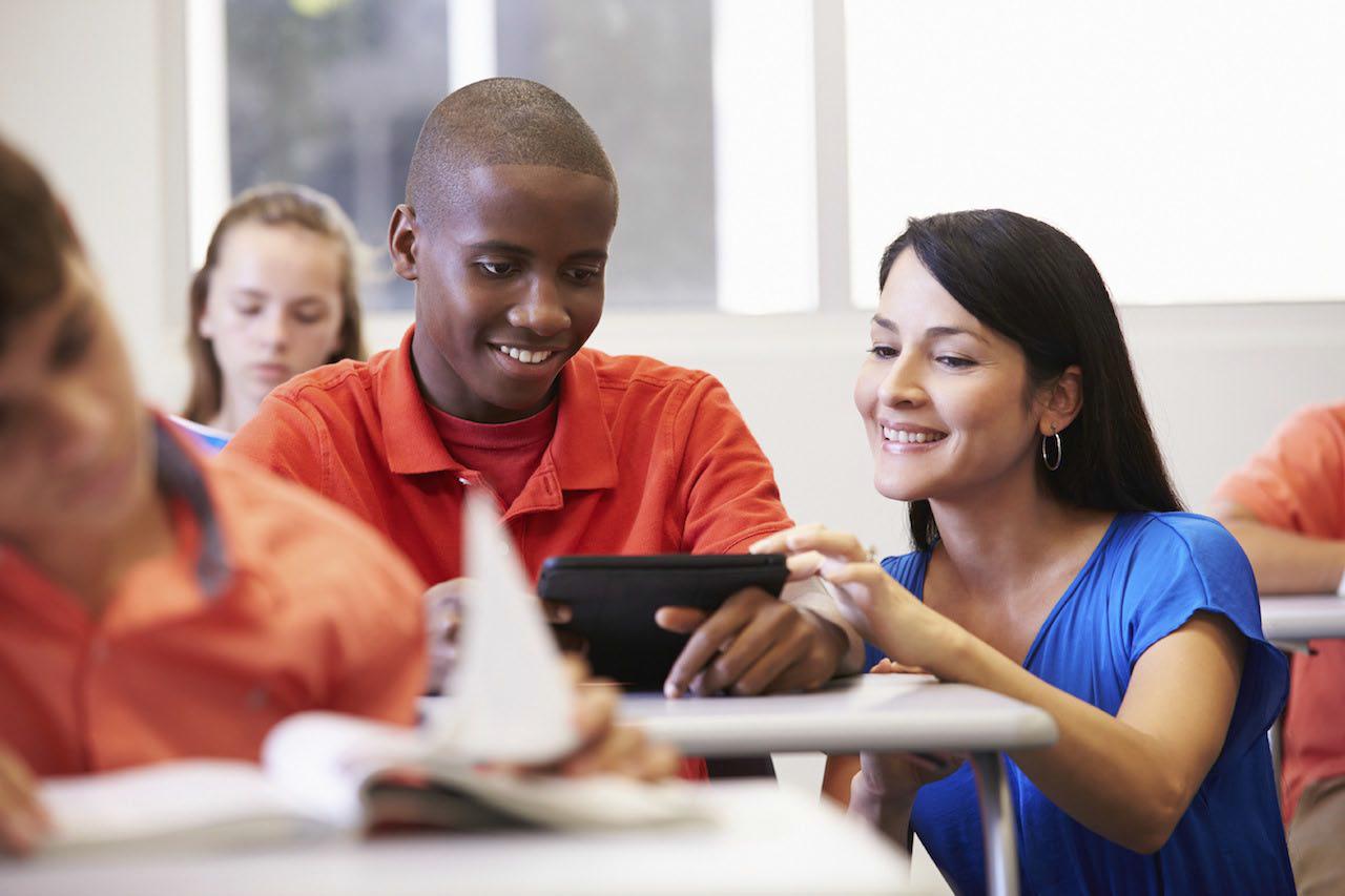 A teacher showing the student more examples about the ongoing lecture.